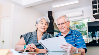 Retired couple reading documents