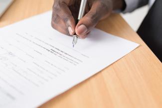 are annuities a good investment, person signing annuity contract