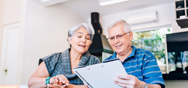 Retired couple reading documents